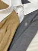 Ropa de Mujer Shenzhen Nanyou: Suéter de Punto Trenzado Falso Dos Piezas con Cuello de Camisa para Mujer, Estilo Universitario de Principios de Otoño, Largo Corto, Top de Manga Larga con Retazos
