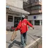 Foto real de la nueva sudadera con capucha de diseño de doble cara para el otoño de 2026 con estampados en la parte delantera y trasera, corte holgado y estilo off-shoulder