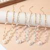 Collar de conchas de estilo transfronterizo para mujer, cadena de clavícula con perla de piedra volcánica, diseño de nicho con sentido de combinación.