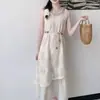 Vestido de encaje hueco sin mangas, estilo vacacional de moda este año, vestido largo estilo étnico relajado con lazo en la espalda