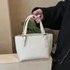 Bolsa Saco Simples Estilo Coreano com Padrão de Lichia para Mulheres 2026 Primavera Nova Design de Nicho Versátil Bolsa de Ombro Wing