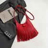Bolso de hombro personalizado estilo coreano para mujer, nuevo modelo de verano 2026, bolso de mano y bolso de axila de gran capacidad con borlas, moderno y a la moda