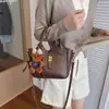 Bolsas Femininas da Moda para Este Ano: Elegante Retrô Textura Simples Versátil Bolsa de Mão Saco de Balde para o Trabalho Nicho Elegante Bolsa Transversal