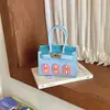 Bolso clásico nuevo estilo retro con forma de casa, presenta un lindo diseño color block, forma de cuadrado mini y opción de conjunto padre-hijo, ofreciendo un look sofisticado y moderno que complementa cualquier atuendo