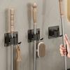 Clip para mopa pistola gris almacenamiento de baño gancho fijo para escoba balcón de baño adhesivo de pared sin perforaciones estante para mopa