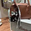 Bolsa de Peluche de Cuero de Dibujos Animados Oso de Peluche Lindo Llavero Cachorro Rizado Colgante Bolsa Pequeña de Fragancia Colgante Colgante