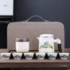 Grasa de oveja jade portátil Qianli Jiangshan taza express regalo de negocios camping al aire libre un juego de té de viaje de cuatro tazas