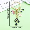 Venta Caliente Transfronteriza Cinta de Música Antigua Saxofón Órgano Llavero Diseño Creativo Sentido Colgante de Bolsa Pequeños Accesorios
