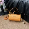 Bolso tejido de patrón único para mujer, nuevo modelo de verano 2026, bolso de mano Maillard de alta gama, bolso cilíndrico de hombro y cruzado
