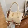 Elegantes bolsos pequeños para mujer, versátiles para primavera y verano, nuevo modelo 2025 con textura de calidad, populares este año, bolso cruzado, bolso de mano, bolso tipo cubo