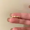 Anel ajustável de seção de bambu de esmalte de gota vermelha Novo anel de dedo feminino Design de nicho Internet Anel celebroso Anel empilhado