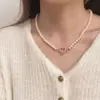 Collar de doble anillo con forma de corazón incrustado con diamantes de imitación, estilo cruzado de gran venta para mujer, cadena para clavícula de aleación ins, diseño de nicho, sentido de diseño, lujo ligero de nicho