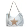 Bolso tote casual tipo tote de estilo nuevo 2026 para estudiantes universitarios, con gran capacidad y diseño único, para uso diario y transfronterizo.