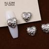 Nuevos accesorios de aleación para decoración de uñas con forma de corazón torcido tridimensional liso con diseño de amor hueco retro japonés