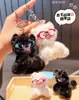 Lindo y Adorable Peluche Pequeño y Esponjoso de Mascota Sentado Llavero Colgante de Mochila Estudiante de Moda Venta al por Mayor