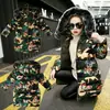 Ropa infantil abrigo acolchado de algodón para niñas 2023 Invierno nuevo estilo coreano para niños medianos y grandes abrigo acolchado de algodón de longitud media con cuello de pelo para niños