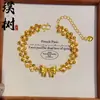 Pulsera de cuentas de disco de doble capa dorada antigua brillante estilo Xiaohongshu con lazo para mujer, pulsera 'princesa fugitiva'