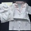 Pijama de Cuadros Jacquard Imitación Seda Estilo Celebridad de Internet para Mujer 2026 Primavera y Verano Conjunto de Dos Piezas de Manga Larga de Seda Helada para el Hogar para Mujer