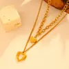 Europa y Estados Unidos collar con colgante de amor en relieve de acero inoxidable transfronterizo titanio no se decolora collar de doble corazón de melocotón 18k para mujer