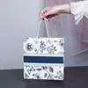 Sacolas de presente transfronteiriças com estampas florais e fitas, sacolas de embalagem de alta qualidade, sacolas de presente para feriados, bolsas de mão, sacolas de embalagem para roupas
