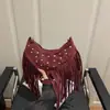 Moda Primavera 2026 Bolso Nuevo con Borlas Tachuelas de Moda Nicho Retro Alto Valor Simple Casual Bolso de Hombro