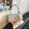 Nova bolsa quadrada pequena elegante para mulheres 2026, uma bolsa de ombro e bolsa transversal estilosa e versátil com um toque de luxo