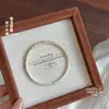 Pulsera Abierta de Plata Pura 999.9 Esmaltada Fushi con Relieve de Peonía, Doble Pez Jugando con Loto, Pintada en Oro, Artesanía Tradicional