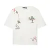 2026 Verano Nueva Moda Femenina Estilo Europeo y Americano Cuello Redondo Versátil Manga Corta Bordado de Flores Camiseta Casual Blanca