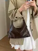 Bolso Estilo Chica Picante Retro para Mujer 2026 Otoño Nueva Llegada Nicho Remache Bolso de Hombro Cruzado Viaje Casual Bolso Dumpling