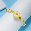 Directo de fábrica moda pequeña fresca flor de arcilla blanda concha pulsera tejida femenina joker cuerda de mano tejida a mano venta al por mayor
