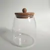 Entrega de fábrica Tarro sellado de vidrio de borosilicato alto vidrio resistente al calor tapa de bambú tarro para té tarro triangular tarro de almacenamiento botella de almacenamiento