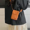 Bolsa Pequeña de Tela de Nylon Simple de Nicho de Verano para Mujer 2025 Nueva Moda Casual Bolso Cruzado Bolso para Teléfono Móvil