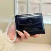Daini Versión Coreana Nuevo Patrón Agrietado Color Sólido Simple Colgante de Lazo de Perla 80% de descuento Cierre de Cremallera Cartera Corta