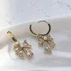 Pendientes de botón con lazo de atmósfera, microincrustaciones de circonita, temperamento suave, alta gama, exquisitos, estilo Ins, venta al por mayor