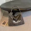 Bolso de hombro de gran capacidad, nueva colección otoño 2026, bolso tote para debajo del brazo, adecuado para el trabajo y los desplazamientos, con diseño de estampado de leopardo, bolso cruzado elegante y moderno