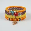 Venta Caliente Transfronteriza Estilo Bohemio Ojo Maligno Palma Aleación Colgante Cuerda Elástica Multicapa Pulsera de Perlas