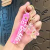 Llavero Colgante Oso Sentado Luminoso de Acrílico Relleno de Aceite Llavero de Máquina de Garra Encanto para Bolso Pequeño Regalo Venta al por Mayor