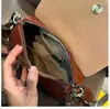 Bolso de mano estilo retro, bolsa para el teléfono del trabajo, bolso cruzado para mujer, nueva moda primavera/verano 2026, bolso pequeño único y elegante, versátil