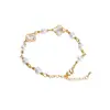 Pulsera de resina con trébol de cuatro hojas facetado, sensación de lujo ligero y alta gama, color dorado, accesorio de pulsera simple exquisito de nicho de Instagram al por mayor