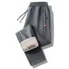 Pantalones casuales gruesos para hombre de cachemira cálida con forro polar, pantalones largos de invierno para hombre, pantalones deportivos con cremallera y bolsillos