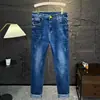 Jeans Rasgados para Hombre Marca de Moda Otoño/Invierno Nuevo Estilo Versátil Regular Lavado Pierna Recta Ajustada Pantalones Largos Venta al por Mayor