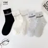 Calcetines para niñas Yishuangshuang, nuevos calcetines de otoño e invierno con forma de corazón de dibujos animados hasta la mitad de la pantorrilla, algodón peinado, calcetines estilo Miu con letras y caras sonrientes para estudiantes