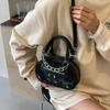 Bolso nicho de alta gama estilo occidental para mujer 2024 Nuevo Verano popular bandolera versátil bolso pequeño redondo portátil al por mayor