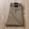 Estación europea pantalones casuales de alta gama para hombre otoño e invierno nuevos de lyocell antiarrugas microelásticos caqui negocios sueltos rectos