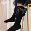 Calcetines de otoño e invierno para niños con lazo de color sólido rojo año nuevo calcetines de tubo calcetines de algodón de viento de princesa para niñas calcetines de baile al por mayor