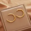Acero de Titanio Color Libre Metal Pendientes Personalizados Europeos y Americanos Calle Casual Accesorios para la Cabeza Pendientes de Anillo Transfronterizos Puesto