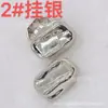 Botón metálico de alta gama hebilla de forma especial botón simple creativo de moda hebilla para suéter de Instagram hebilla para traje de suéter accesorios