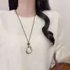 Nueva colección otoño/invierno: Collar colgante lágrima de piedra ojo de tigre color café, un accesorio de cadena larga delicado y lujoso para suéteres
