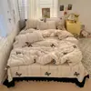 Juego de ropa de cama vintage de cuatro piezas estilo francés de terciopelo de leche con colcha, sábana acolchada de franela de doble cara engrosada para invierno y funda de edredón