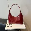 Bolso pequeño de piel aceitosa con textura de alta calidad para mujer, nuevo estilo 2025, bolso cruzado versátil y moderno, bolso tote pequeño súper popular para un solo hombro o debajo del brazo